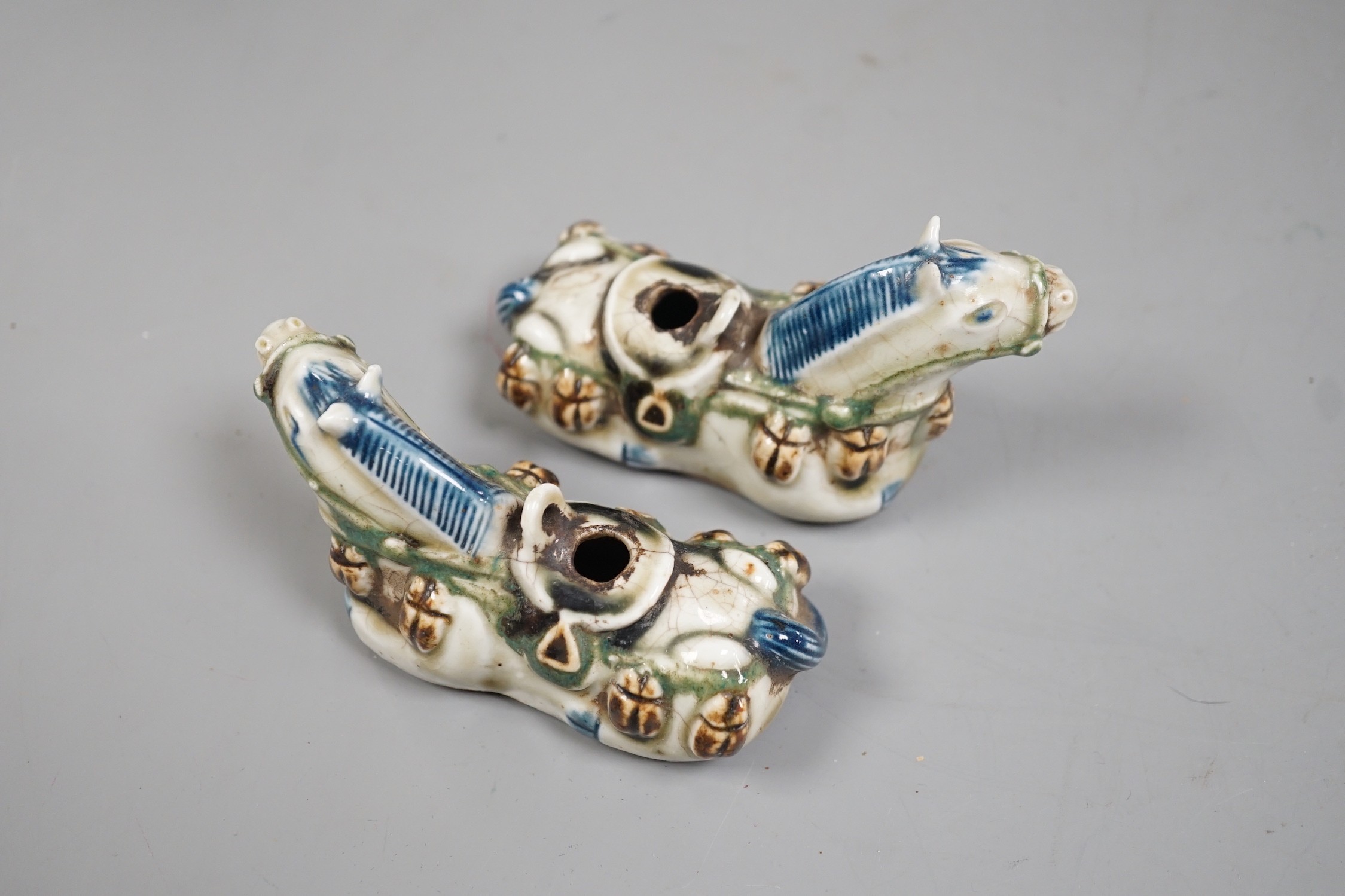 A pair of Chinese stoneware 'horse' rose water droppers, 10cm long